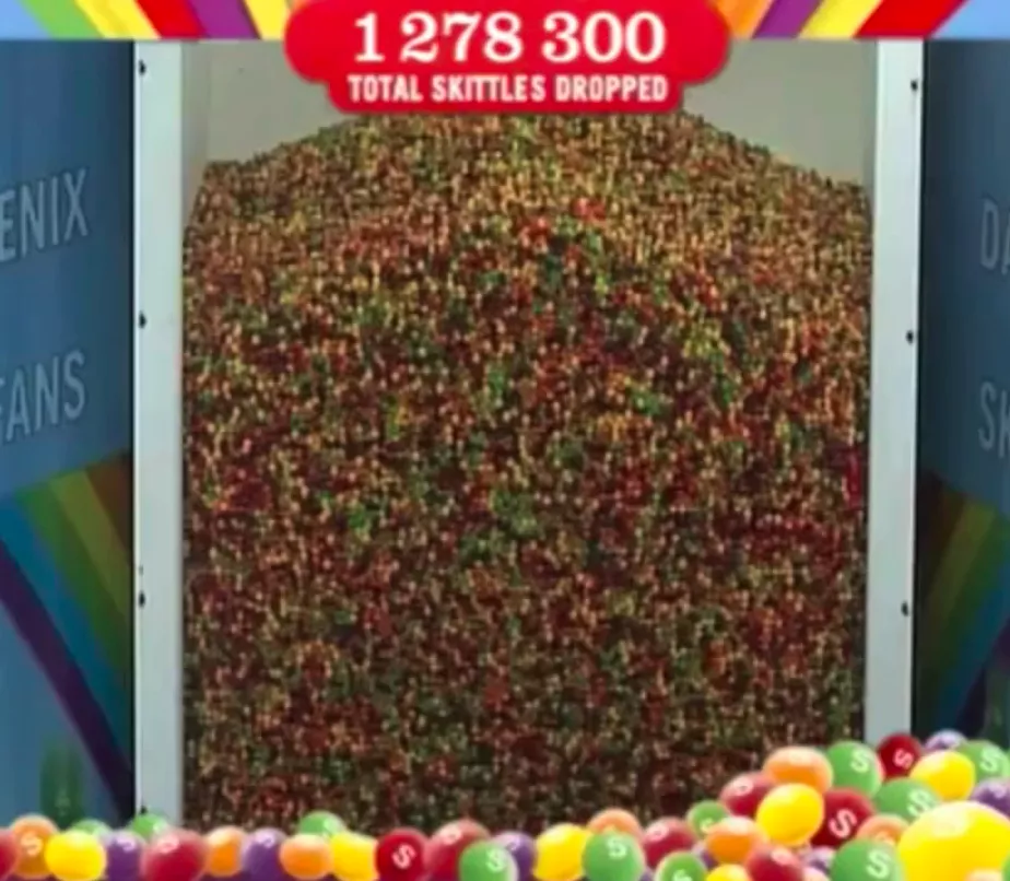 Man covered in 1278300 Skittles